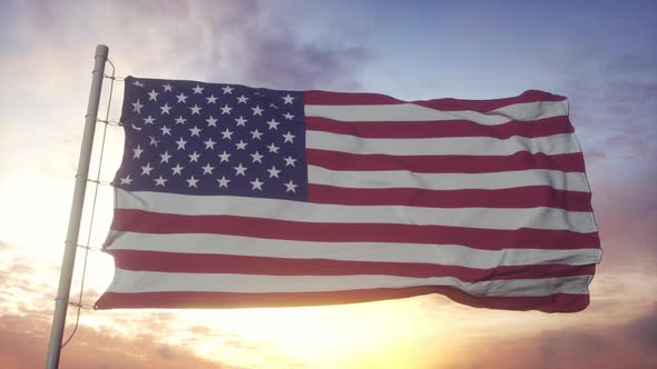 Flag of United States of America Waving in the Wind Against Deep Beautiful Sky at Sunset