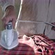 Male hands ironing clothes with iron on ironing board - VideoHive Item for Sale