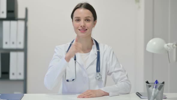 Thumbs Up Sign By Female Doctor