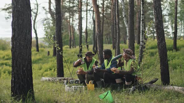 Ecologists Snacking in Forest