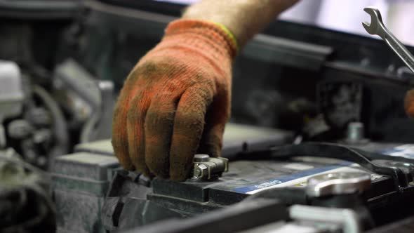 car battery replacement. close-up. auto repair shop.