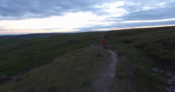 Aerial shot of a mountain biker on a singletrack trail