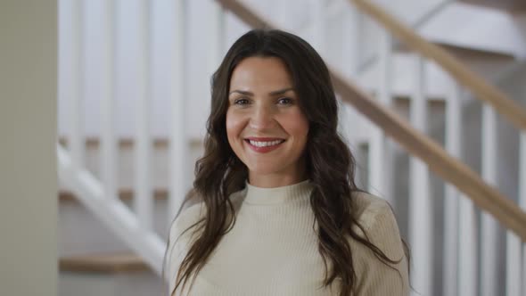 Portrait of caucasian woman looking at camera and smiling