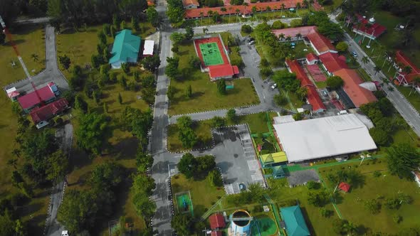 Cinematic Drone Footage of Palm Oil Mill Effluent residential consists of buildings, homes, main roa