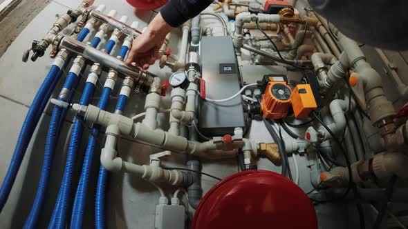 Professional plumber. Plumbing repair service. Repairman fixing a gas water heat