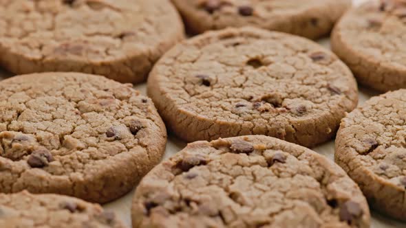 Round Chip Cake Cookies with Chocolate on Flat Surface Slow Rotating Looped Background