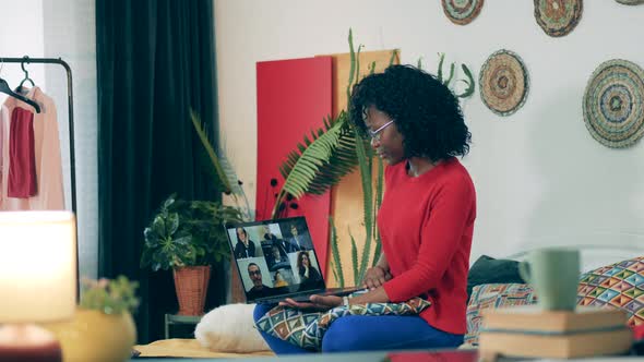 African Woman Is Talking To Multiple People Via Laptop During Lockdown