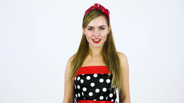 A Beautiful 50s Pin-up Girl Smiles at the Camera - White Screen Background