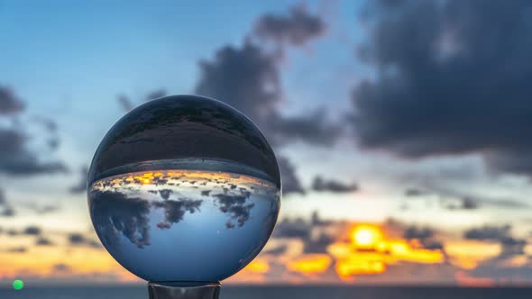Timelapse Cloud Moving Inside Crystal Ball In Sunset.