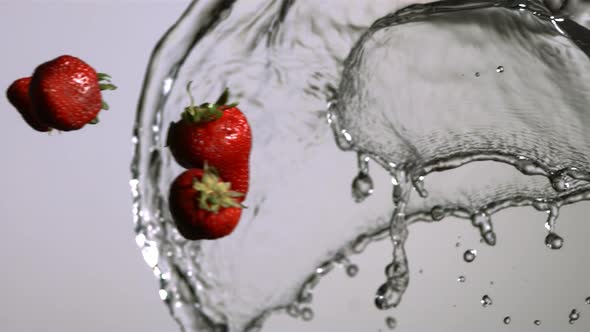 Water splash with fruit in ultra slow motion 