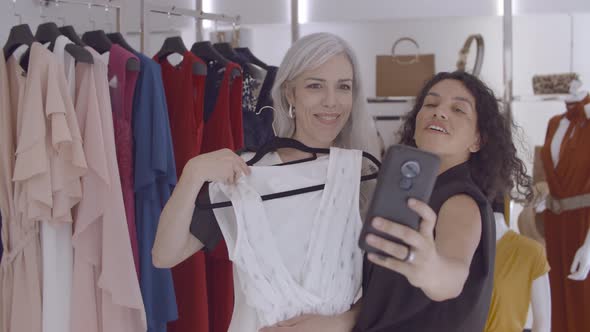 Happy Female Friends Enjoying Shopping Together