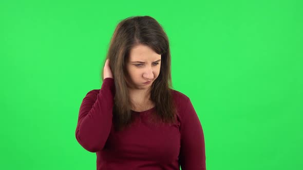 Portrait of Pretty Girl Thinking About Something, and Then an Idea Coming To Her. Green Screen