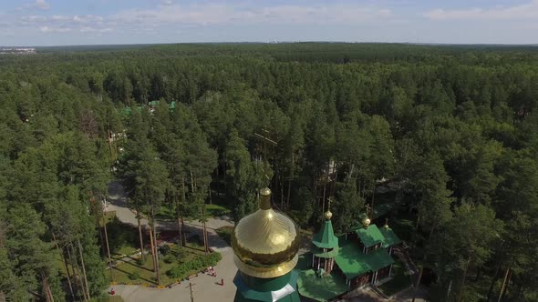 Aerial view of churchs in Monastery in forest. Sunny summer day 06