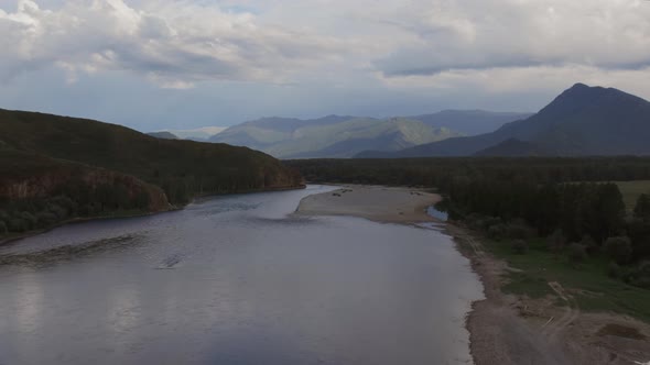 Majestic river Katun in valley of Altai under dramatic sky