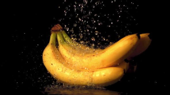 Super Slow Motion Water Droplets Fall on Bananas