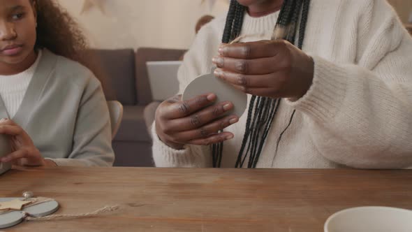 Mother and Daughter Preparing Christmas Present