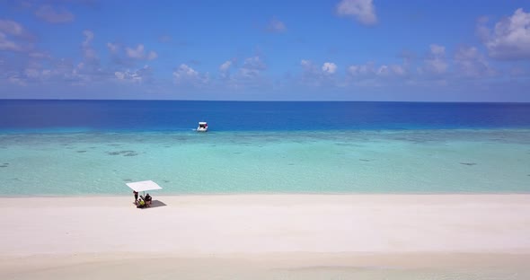 Young people married on vacation have fun on beach on white sand background 4K