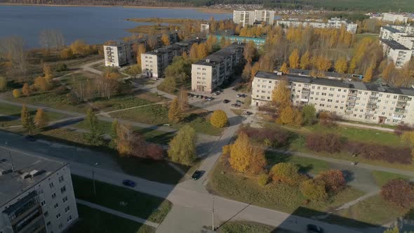 Aerial view of alley near the pond in a provincial autumn town 22