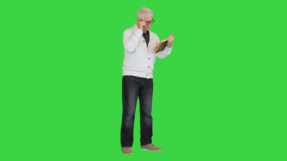 Focused Stylish Old Man Reading Book Green Screen Chroma Key