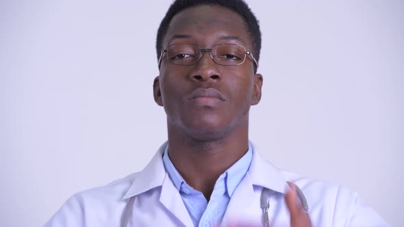 Face of Young African Man Doctor Showing See No Evil Concept