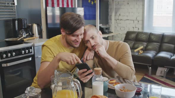 Loving Same-Sex Couple Using Mobile Phone