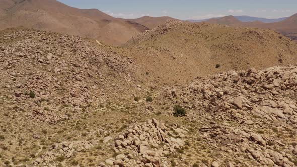 Aerial shot of interesting rock formations in the desert of California