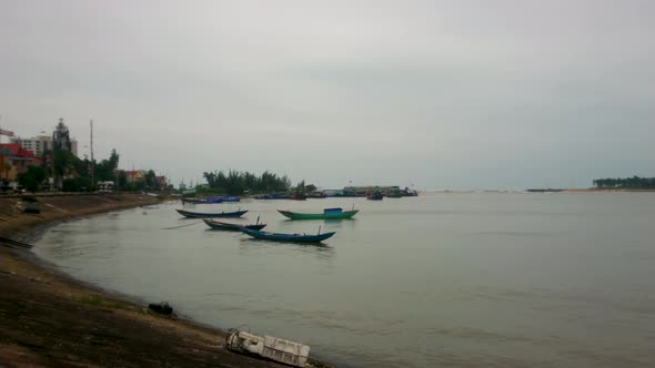 Vietnam fishing boats in a river, tripod shot