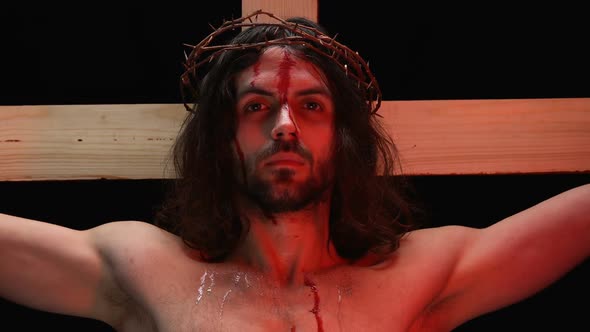 Suffering Son of God Crucified on Wooden Cross Closing Eyes, Religious Humility