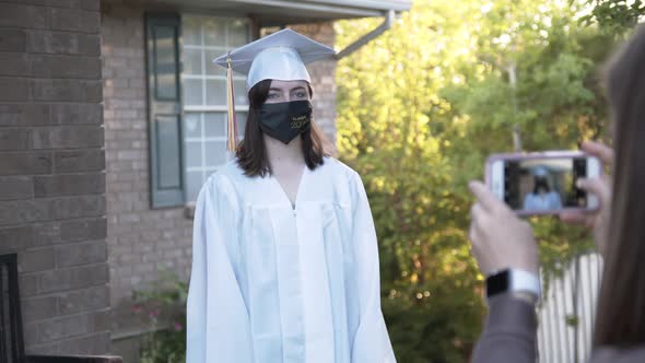 High school girl posing for photo wearing face mask