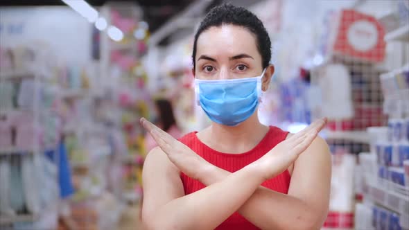 Portrait of a European Woman in a Mask From a Coronavirus Epidemic Makes Purchases in a Supermarket
