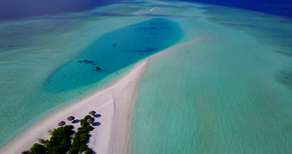 Natural flying island view of a white paradise beach and blue sea background in vibrant 4K