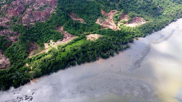 Aerial view fly toward mining of sand cause deforestation