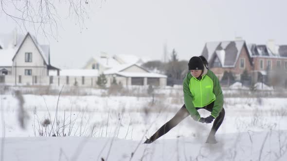 Woman Doing Side Lunges Outdoors in Winter