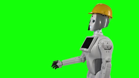 Robot in a Builder's Helmet Waves Hi and Talks. Green Screen. Side View