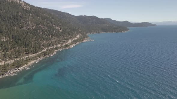 Drone flying along the coast of Lake Tahoe near Incline Village