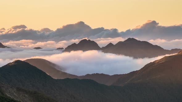 Colors of Sunset Evening with Clouds in Misty Mountains Nature in New Zealand Wilderness Landscape