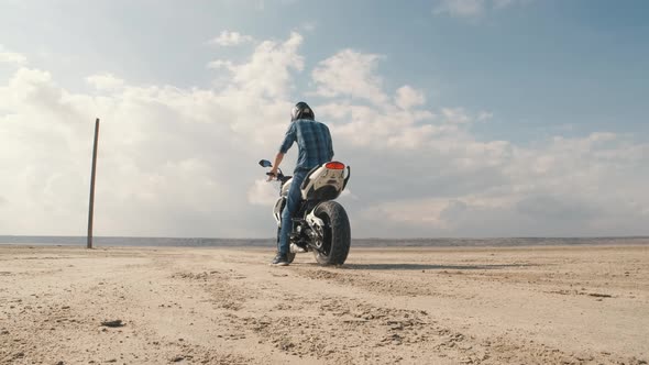 Man Biker Doing Tire Burnout in the Desert Slow Motion