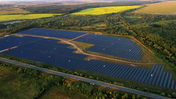 Solar Panels in the Lines on the Field Near the Highway