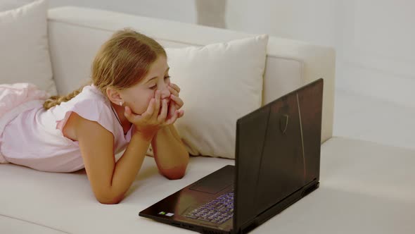 Girl Looking at Laptop