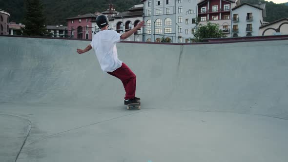 Skateboarding in Special Park Sportsman is Riding Skateboard in City Park