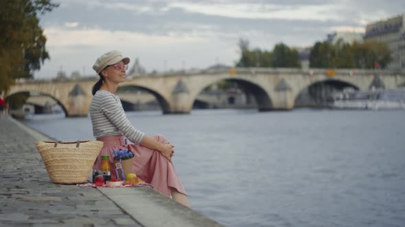 Attractive tourist on a picnic by the river