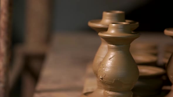 Handmade Ceramic Vases on Shelf in Pottery Workshop