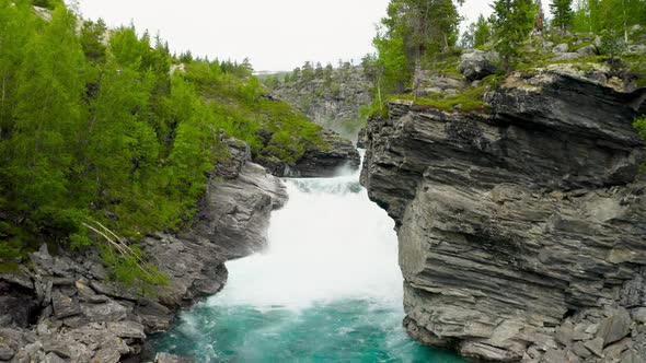 Mountainous River With Strong Current And Rocks In Stryn, Norway - aerial drone shot