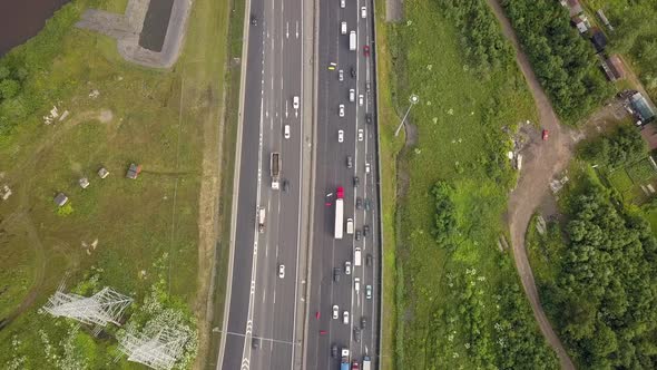 Aerial Vertical Shot. Cars Driving By the Road. Moving Camera To the Bridge