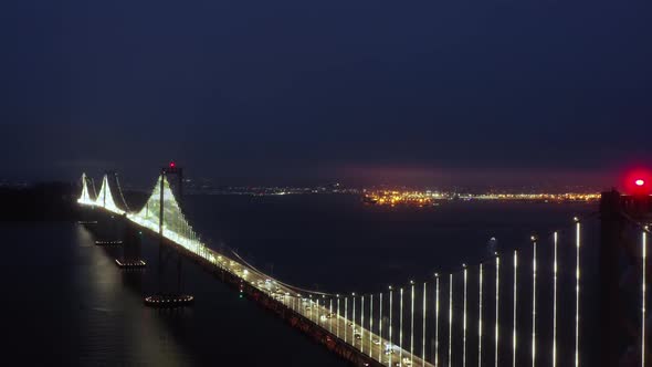 Night Scene of the Cityscape. Aerial of Bridge Towers with Red Navigation Light