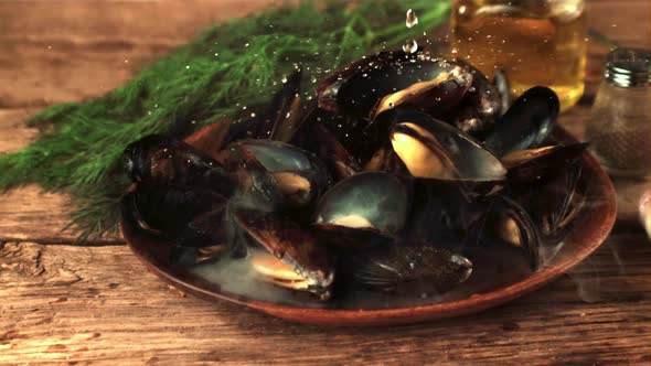 Super Slow Motion on the Mussels in the Plate Fall Water