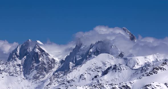 Timelapse of clouds flowing over a mountain range