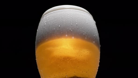 Close-up beer in glass. Slow Motion.