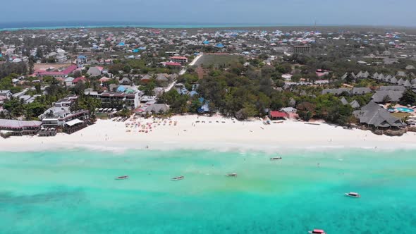 Aerial Paradise Sandy Beach with Turquoise Ocean and Luxury Hotels in Zanzibar