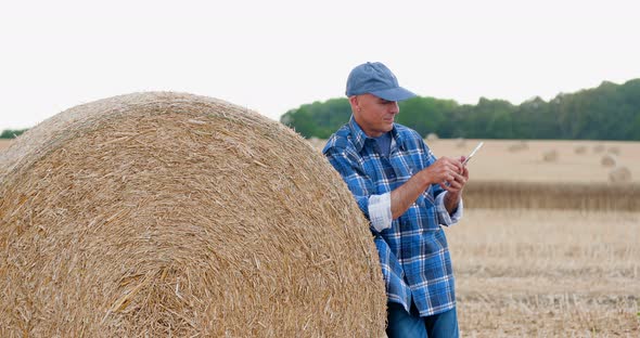 Modern Farmer Using Digital Tablet